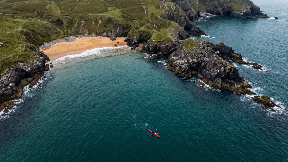 Irish coastline with sea cliffs and a hidden cove, typical of the west coast